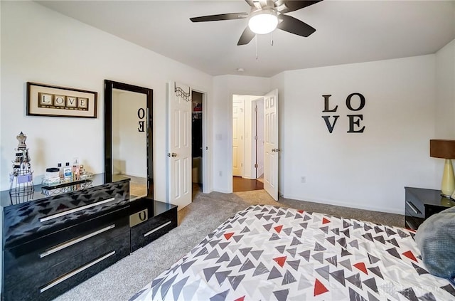 bedroom featuring ceiling fan and carpet