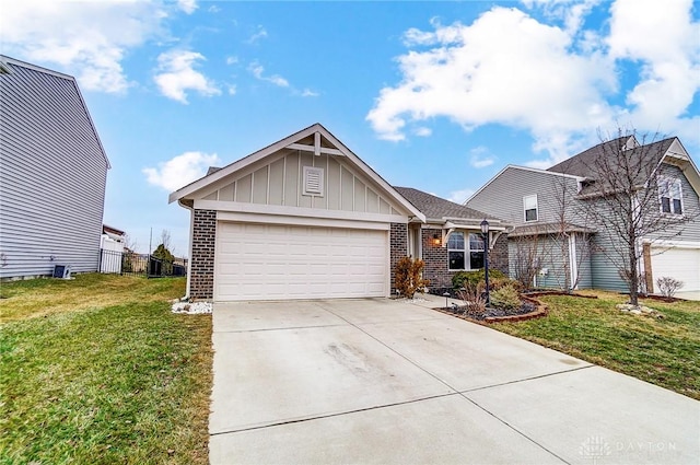 view of front of house with a garage and a front lawn