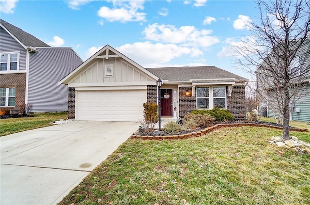 view of front of house featuring a garage and a front yard