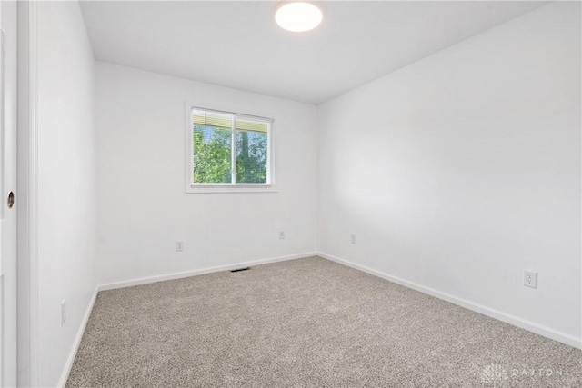 spare room featuring carpet floors