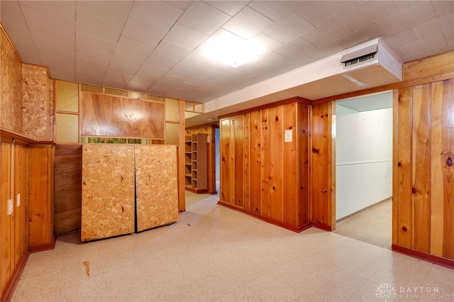 basement with wooden walls