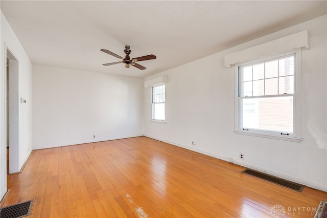 unfurnished room featuring ceiling fan and light hardwood / wood-style floors