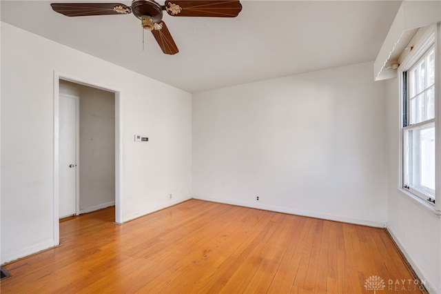 empty room featuring ceiling fan and light hardwood / wood-style floors