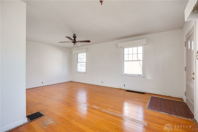 unfurnished room featuring light hardwood / wood-style floors and ceiling fan