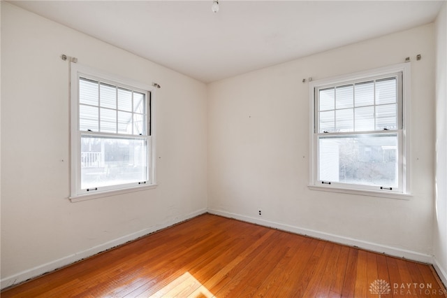 unfurnished room with light hardwood / wood-style flooring