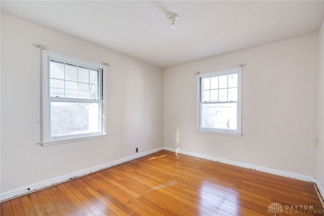 spare room featuring light hardwood / wood-style floors