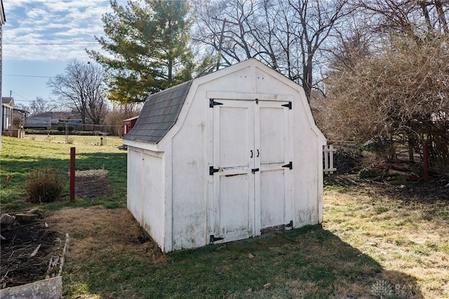 view of outbuilding with a yard