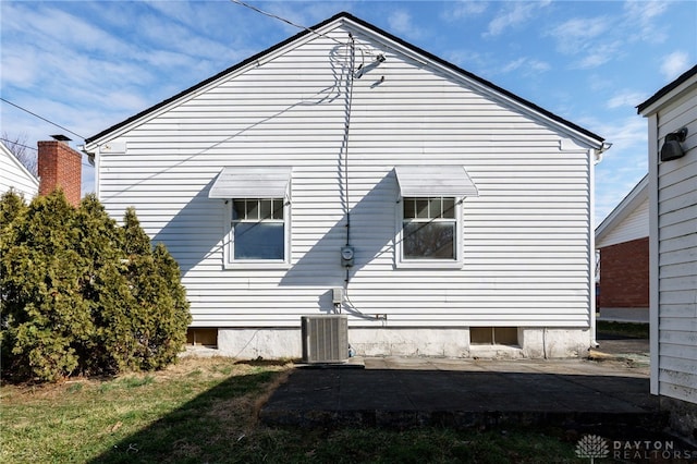 view of home's exterior featuring a patio and central AC unit