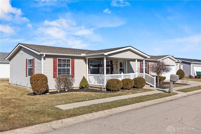 ranch-style house with a porch and a front lawn