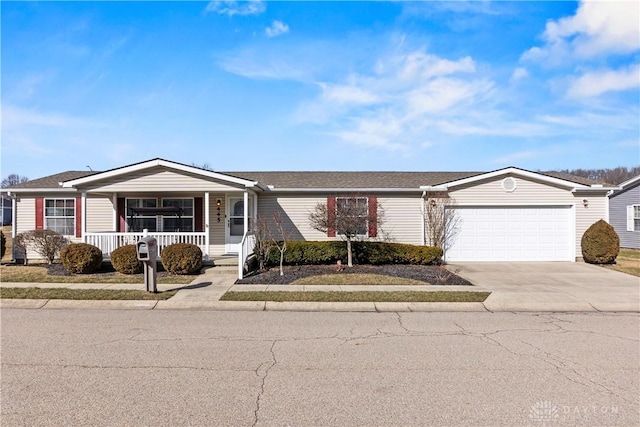 single story home with a garage and covered porch