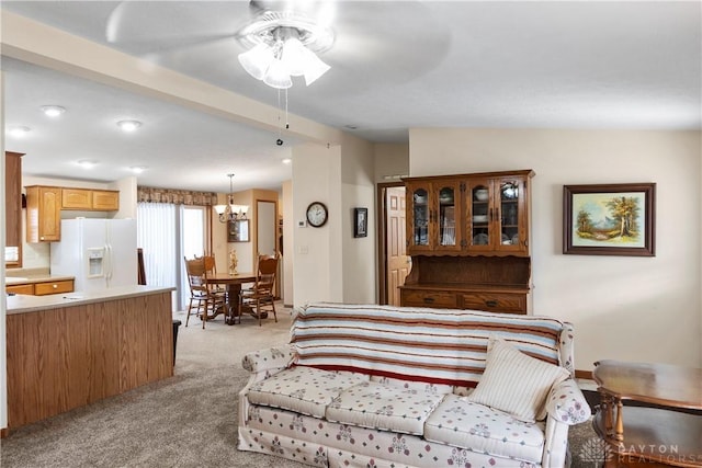 interior space featuring light carpet and an inviting chandelier