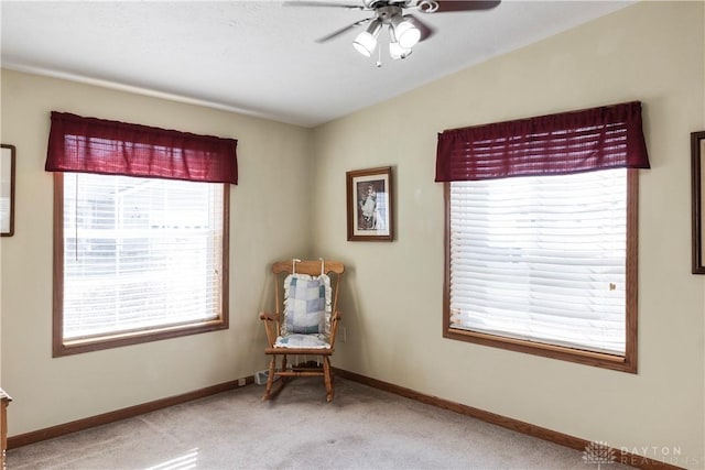 unfurnished room with vaulted ceiling, light colored carpet, and ceiling fan