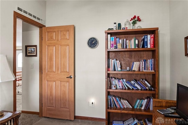 living area with carpet