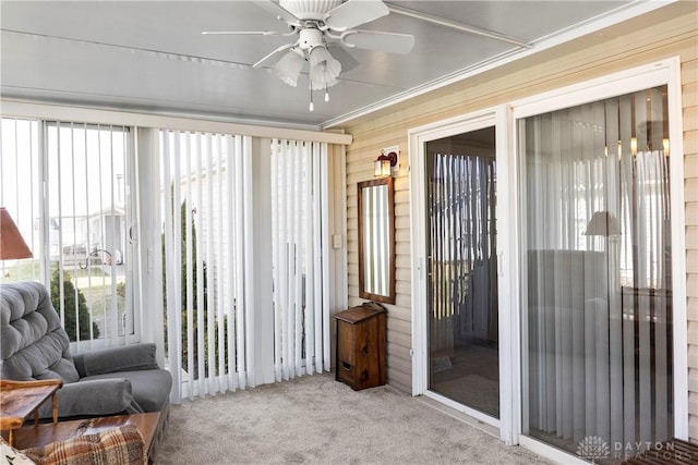 sunroom / solarium with plenty of natural light and ceiling fan