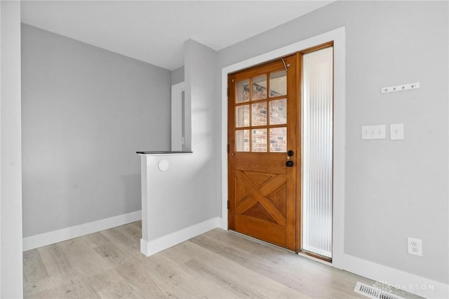 foyer with light hardwood / wood-style flooring