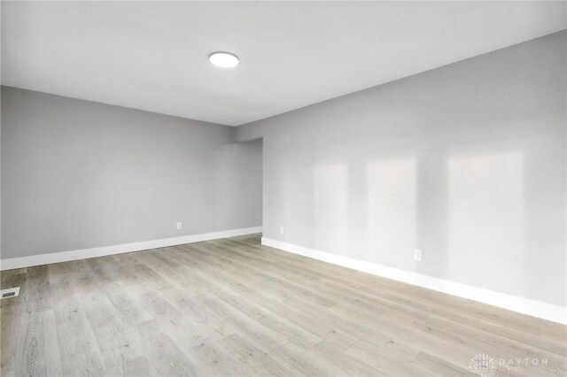 spare room with light hardwood / wood-style floors