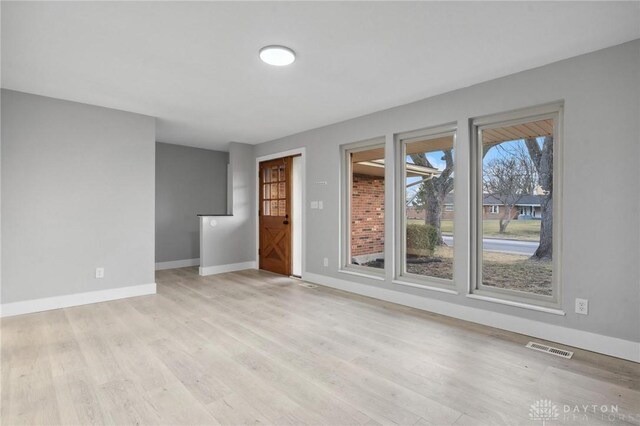 empty room with light wood-type flooring