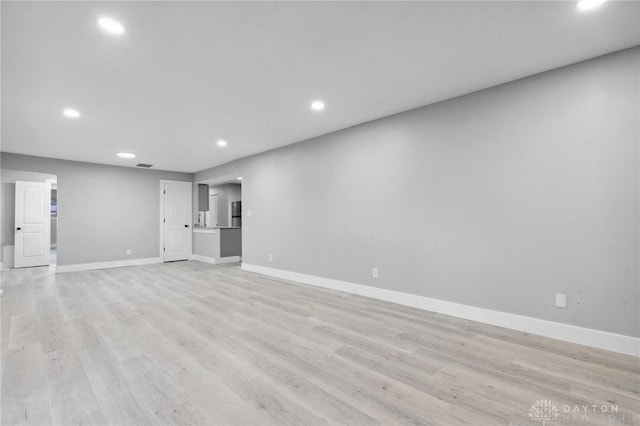 unfurnished living room featuring light wood-type flooring