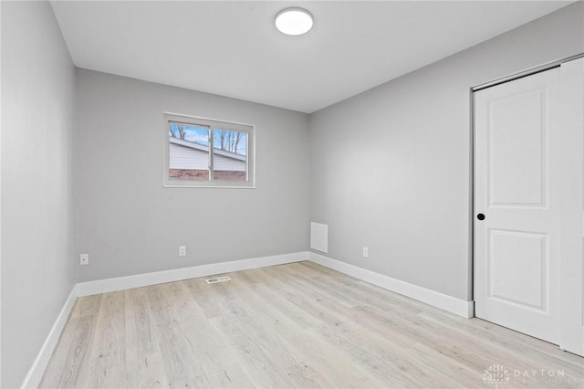 empty room with light wood-type flooring