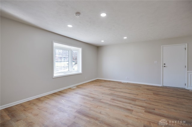 unfurnished room featuring light hardwood / wood-style flooring