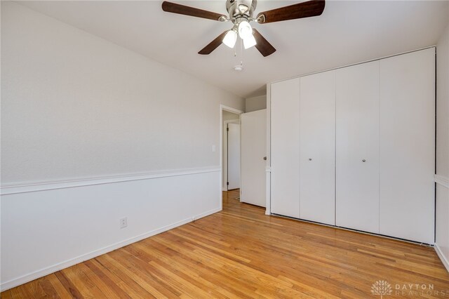 unfurnished bedroom featuring a closet, ceiling fan, and light hardwood / wood-style flooring