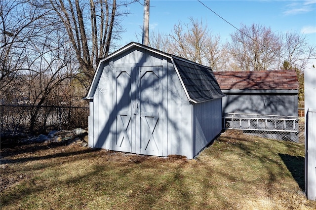 view of outbuilding featuring a yard