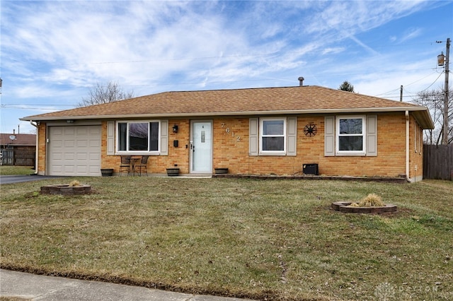 ranch-style home with a garage and a front yard