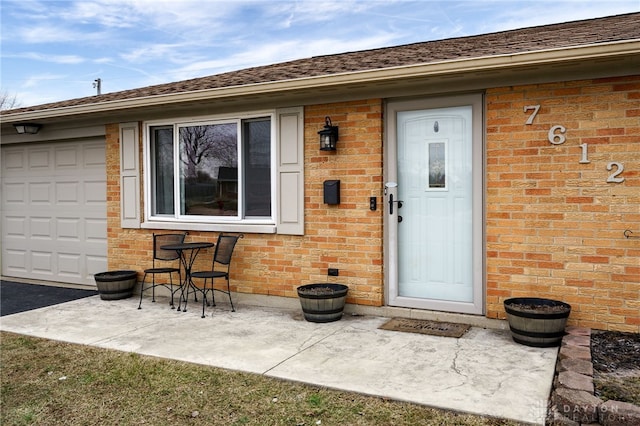 entrance to property featuring a patio