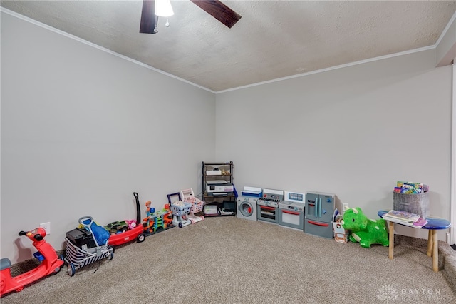 game room with ceiling fan, ornamental molding, a textured ceiling, and carpet flooring