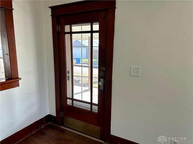 doorway to outside featuring dark hardwood / wood-style floors