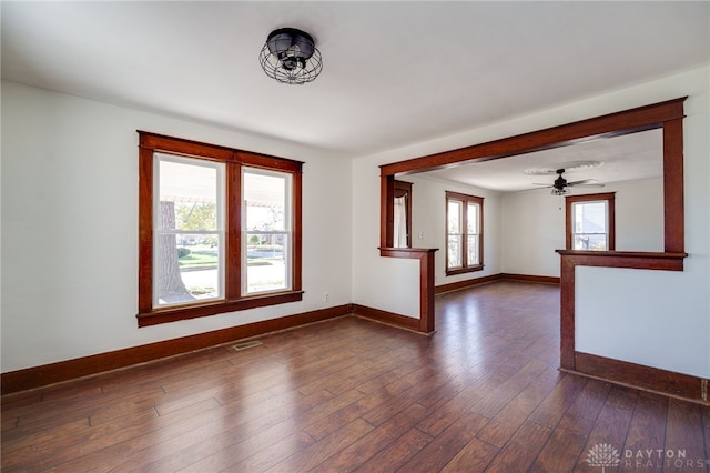 empty room with dark hardwood / wood-style floors