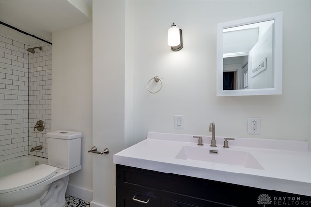 full bathroom featuring vanity, toilet, and tiled shower / bath