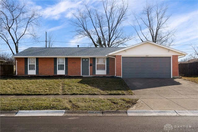 ranch-style home with a garage and a front yard