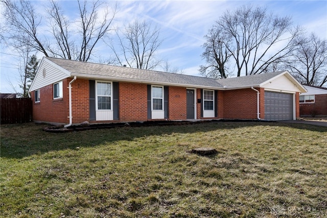 single story home featuring a garage and a front lawn