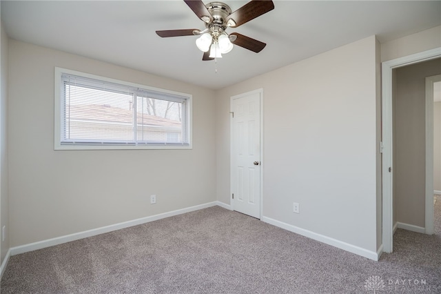 unfurnished bedroom with light colored carpet and ceiling fan