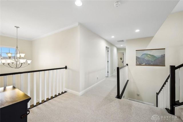 hall with baseboards, an inviting chandelier, carpet, an upstairs landing, and recessed lighting