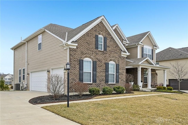 view of front of home featuring brick siding, an attached garage, central AC, driveway, and a front lawn