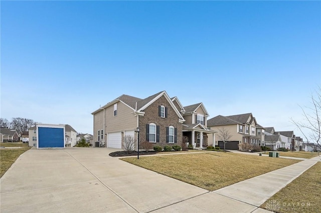 view of front of home with a garage, brick siding, concrete driveway, a residential view, and a front lawn