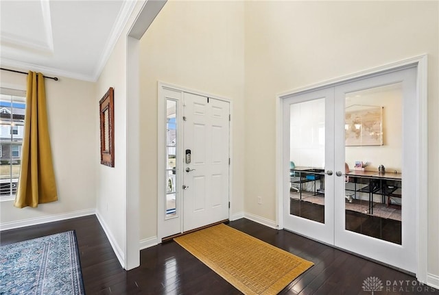 entryway with baseboards, dark wood-style flooring, crown molding, and french doors