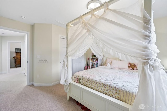 bedroom featuring carpet floors, a closet, and baseboards