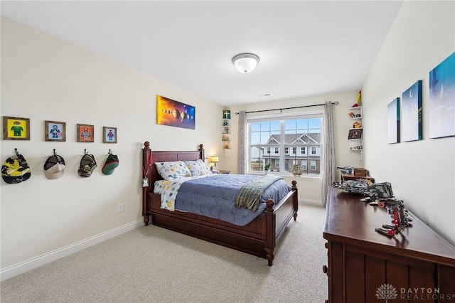 carpeted bedroom with baseboards