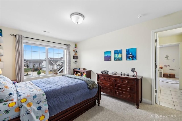 bedroom featuring carpet floors and visible vents