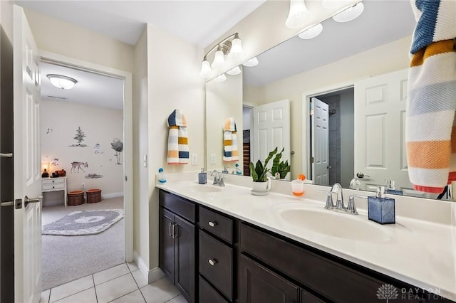 full bathroom featuring double vanity, an enclosed shower, a sink, and tile patterned floors