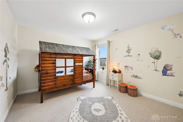 bedroom with light colored carpet, visible vents, and baseboards