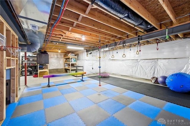 unfinished basement featuring visible vents and tile patterned floors