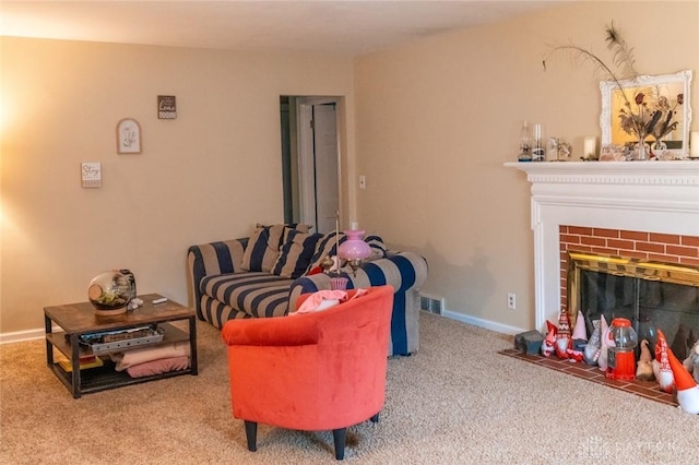 carpeted living room featuring a fireplace