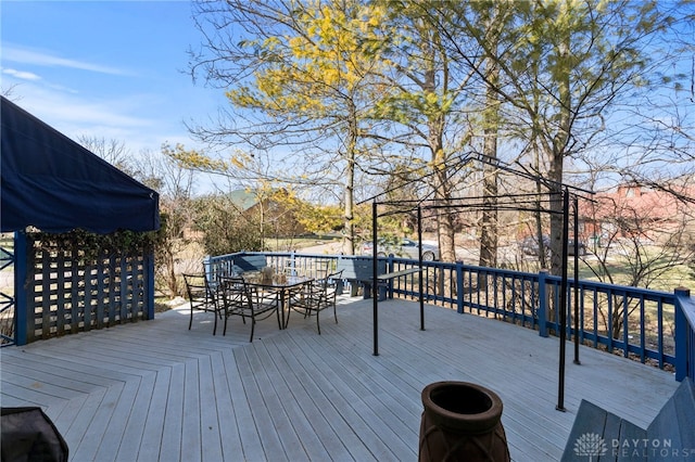 wooden deck with outdoor dining area