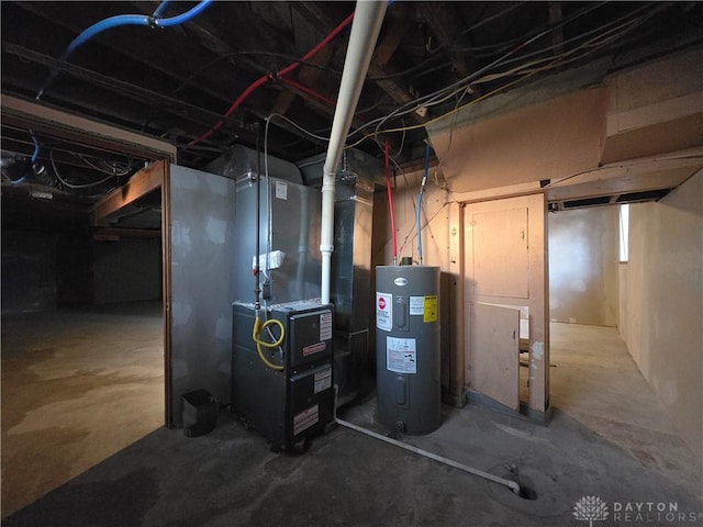 utility room featuring electric water heater