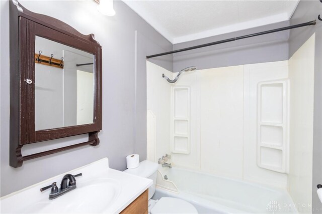 full bathroom featuring vanity, tub / shower combination, and toilet