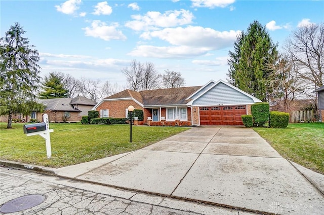 ranch-style home featuring a garage and a front lawn